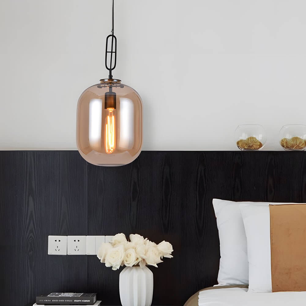 Aureon glass can pendant light in smoke gray above a modern dining table