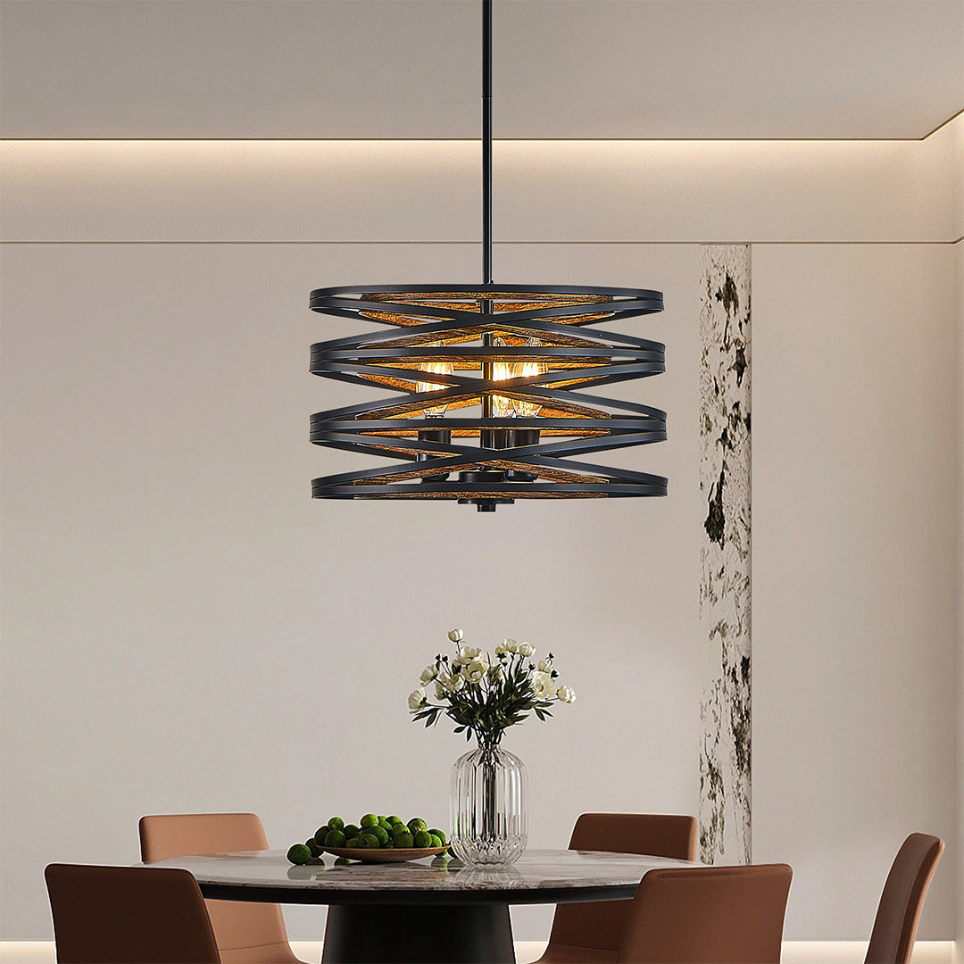 Aureon black iron drum pendant light above a spacious dining table in a contemporary space