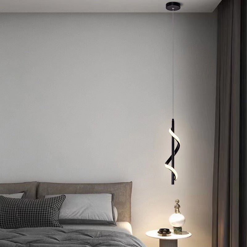 Set of Aureon black pendant lights above a dining area in a modern interior