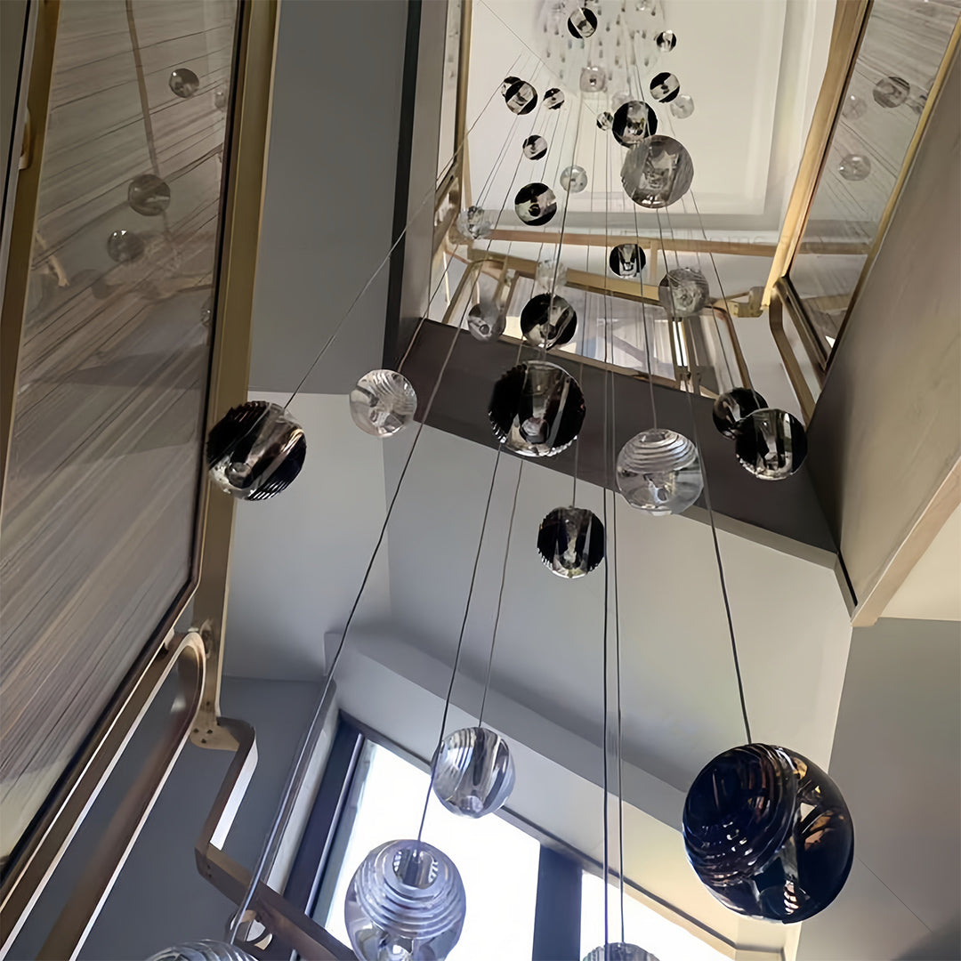 Stylish Aureon smoked glass sphere pendant lights in a modern interior setting