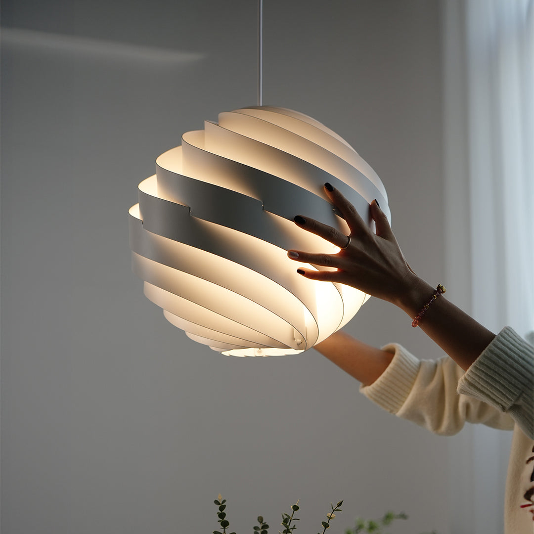 Aureon swirl pendant light in a residential interior, modern spiral aluminium light fixture