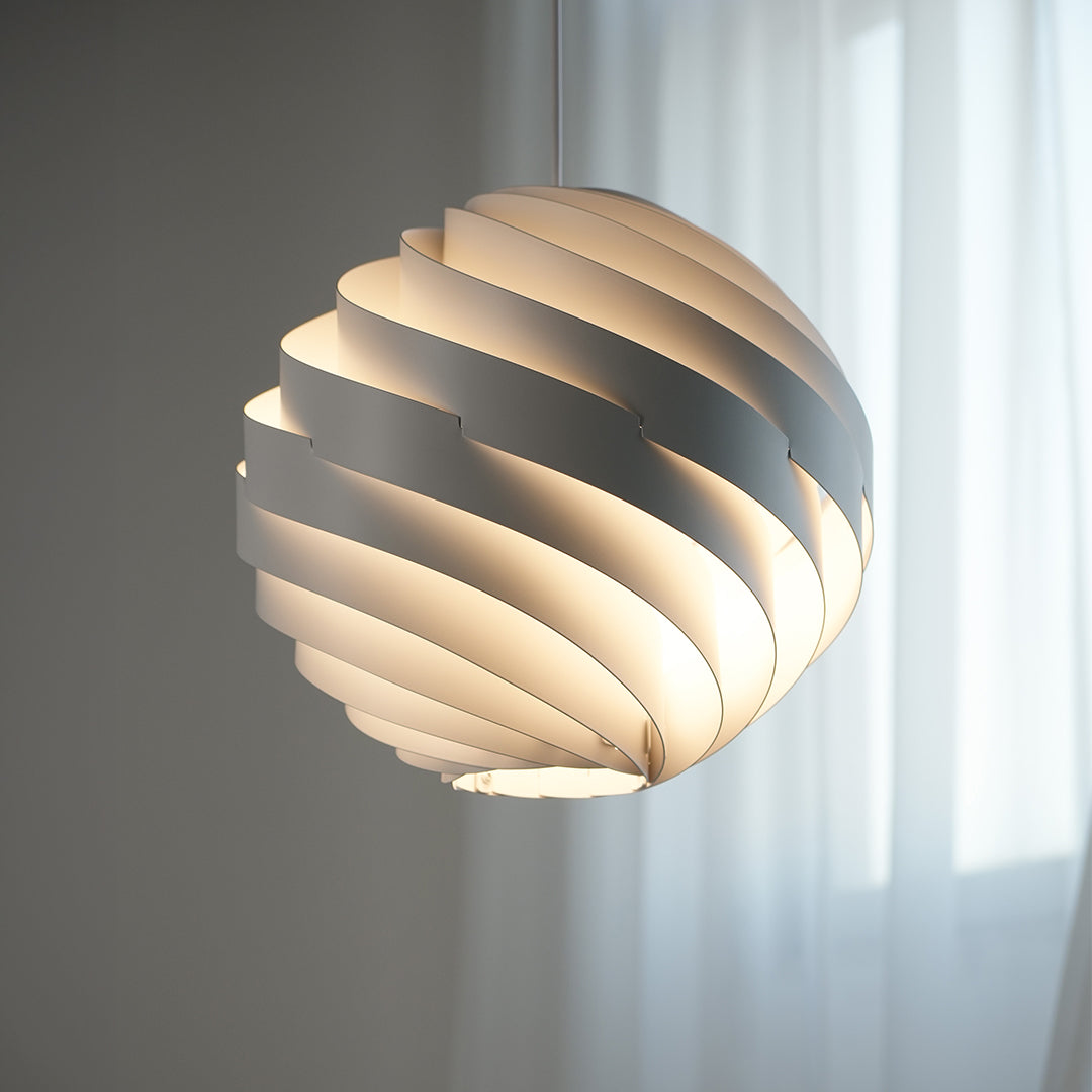 Aureon swirl pendant light emitting a soft warm glow, integrated LED ceiling light