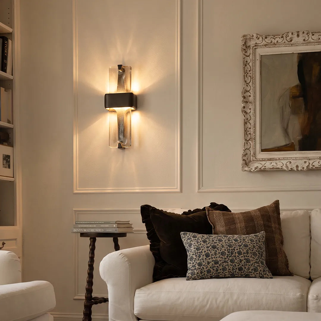 Niva decorative wall sconce mounted above a sofa in a modern living room