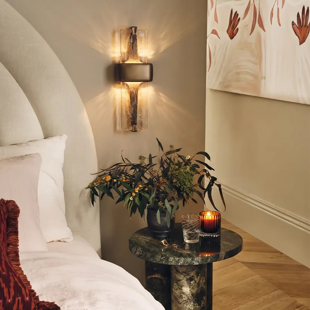 Niva textured resin wall sconce used as bedside wall light, black finish