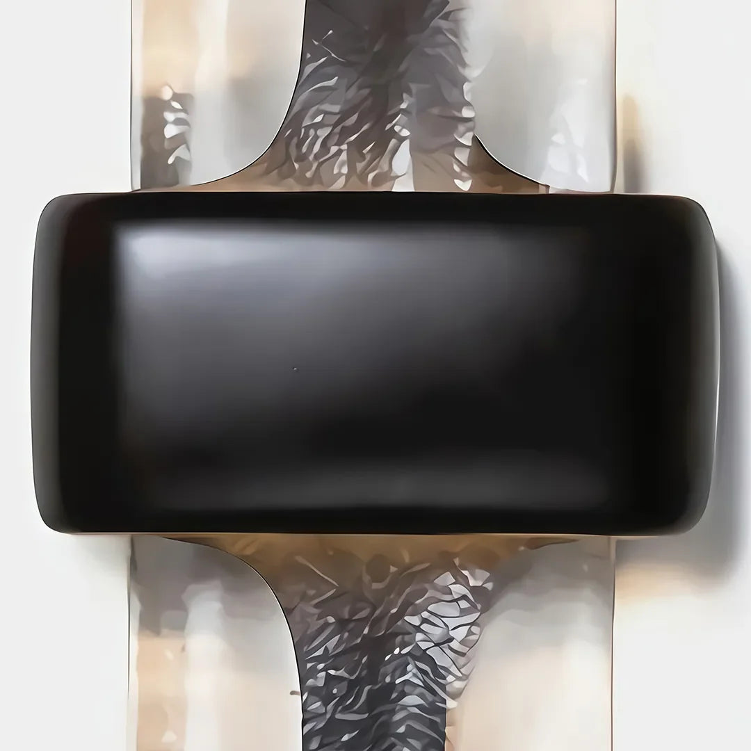Close-up of Niva resin wall sconce showing black band detail and textured surface