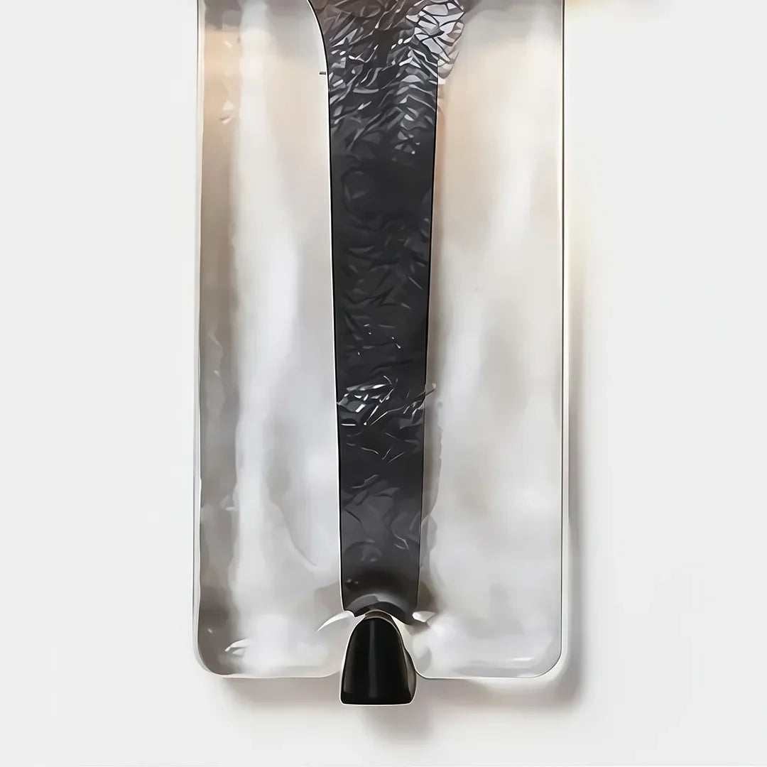 Close-up of Niva wall sconce showing textured resin panels with art glass-effect finish