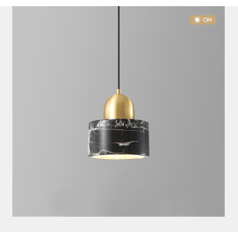Close-up of Aureon marble shade pendant light showing natural stone texture and metal body