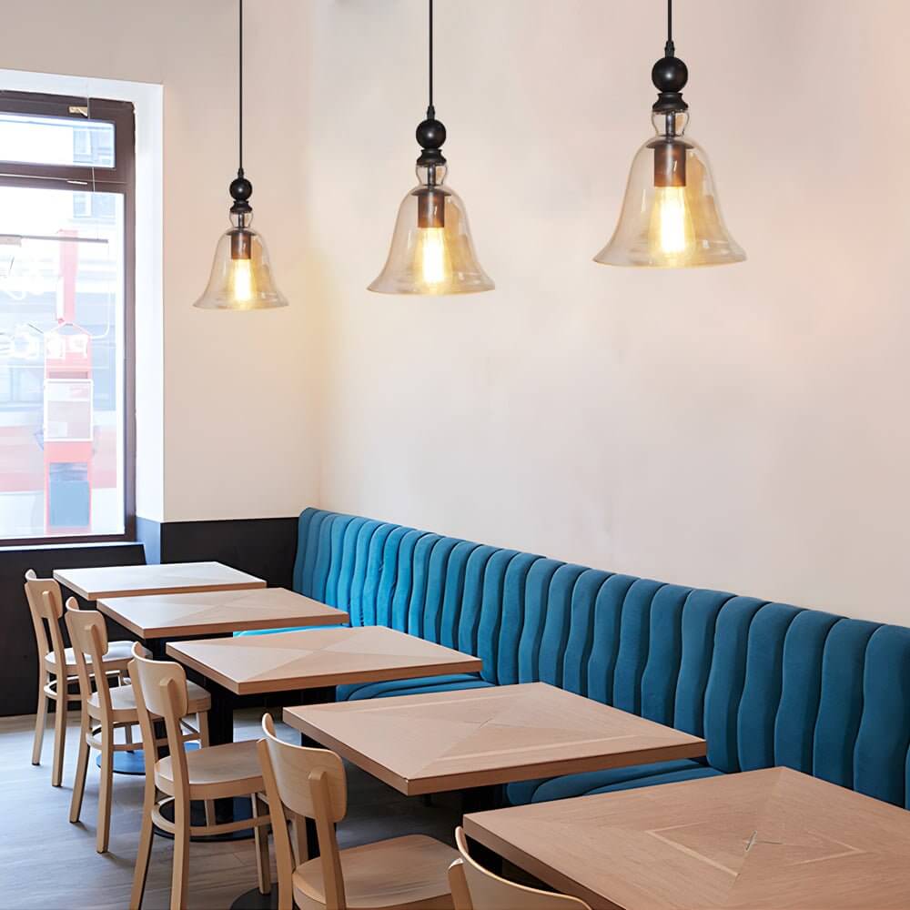 Aureon modern pendant light with warm 3000K glow above a dining table
