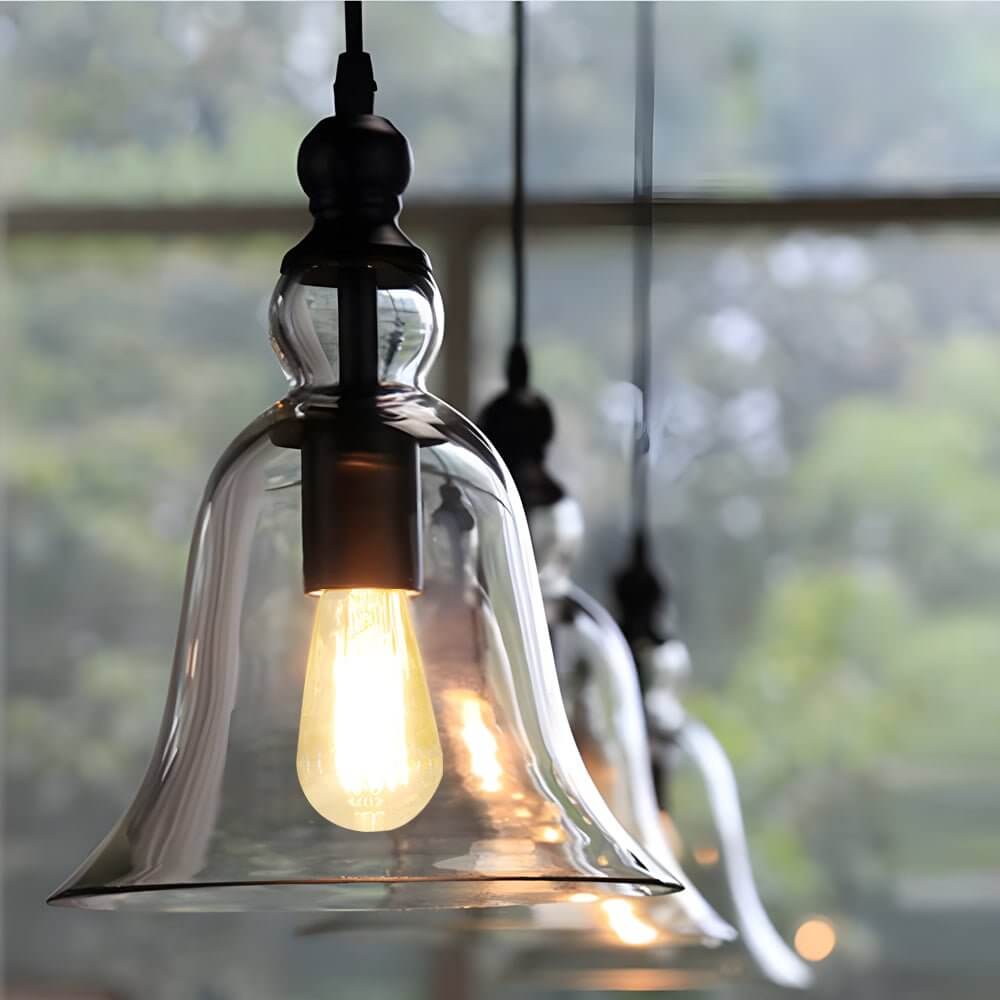Aureon black iron and glass pendant light hanging in a modern industrial dining room