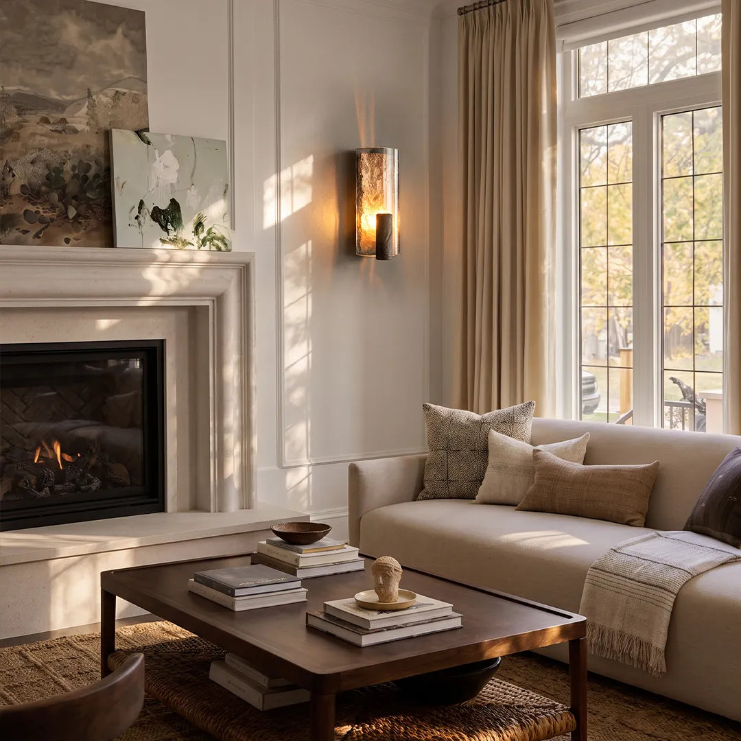Niva wall sconce beside a window in a modern interior, casting warm ambient light