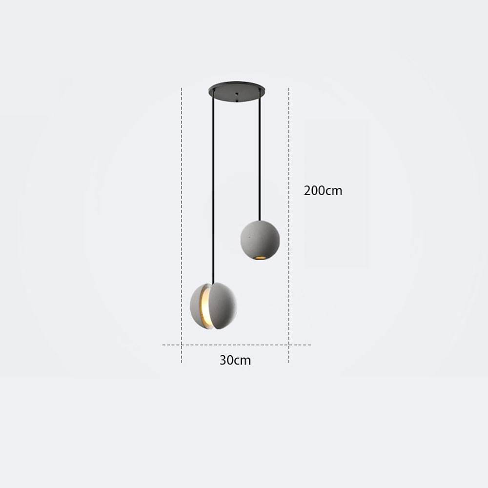 Aureon globe pendant light in 12-inch size hanging above a dining table